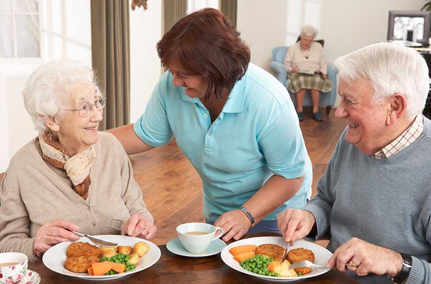 seniors eating dinner at the healthcare center
